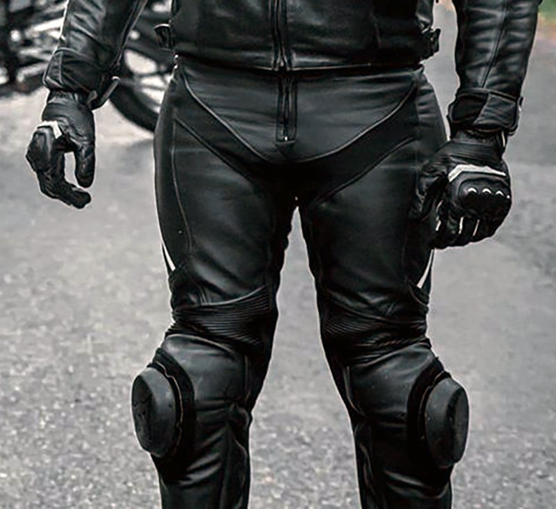 Black two piece leather motorcycle suit with knee sliders